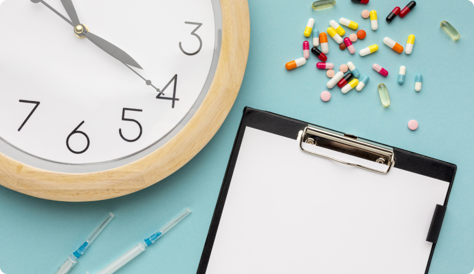 Wall clock with pills, syringes, and clipboard on desk
