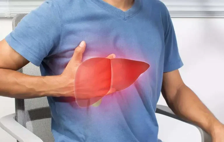 Man holding right side abdomen with highlighted liver pain