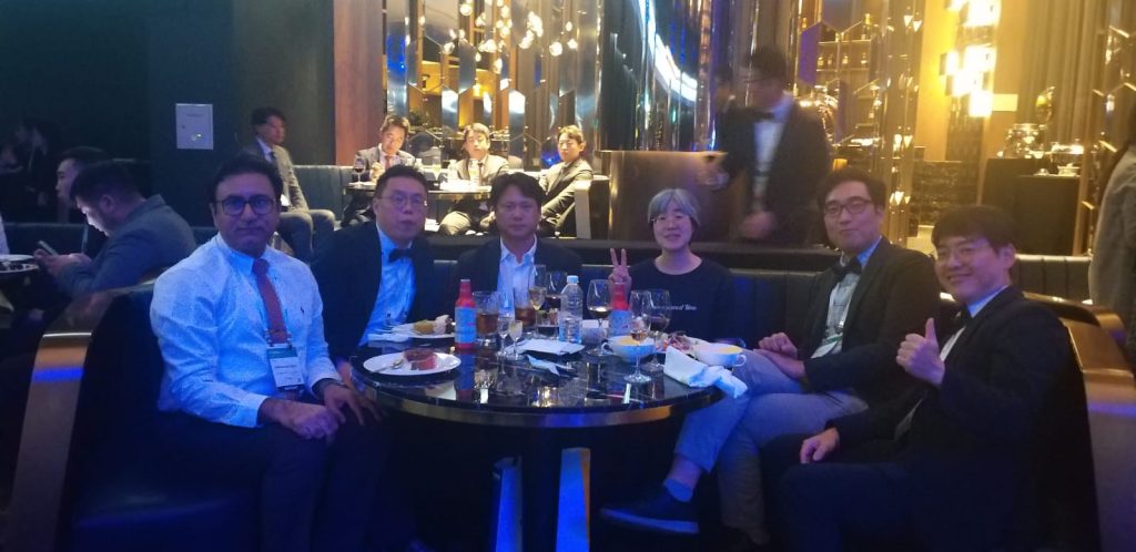 Doctors networking at international medical conference dinner